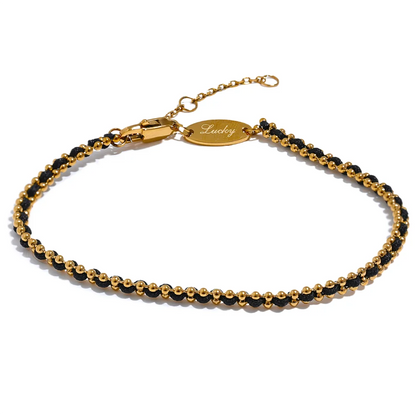 bracelet-femme-elégance-en-fil-noire-perles-dorées