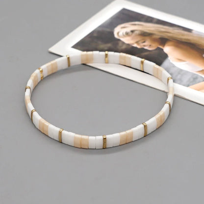 bracelet-perle-en-verre-blanc-doré