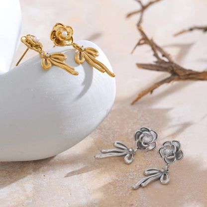 en argent et doré cette boucle d'oreille noeud acier inoxydable est disponible